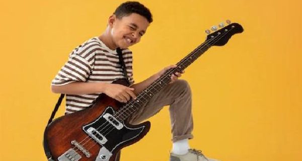 portrait-young-boy-with-guitar_23-2149185174